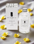 TLC Candle Co. Reed Diffuser Oil bottle with floral accents on a soft background, perfect for creating a soothing atmosphere.
